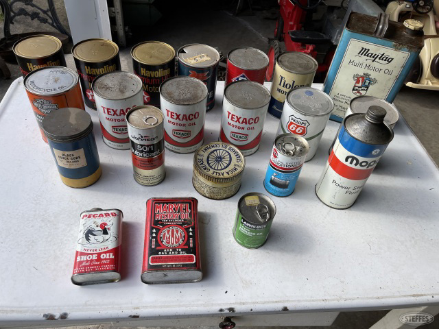 box of vintage oil cans